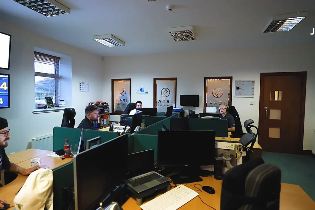 Far away shot of Jera IT team members working on computers in the office