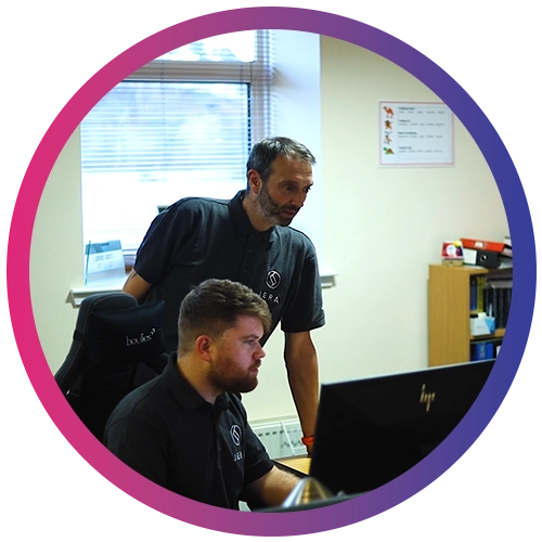 Jera IT team using a computer working with clients