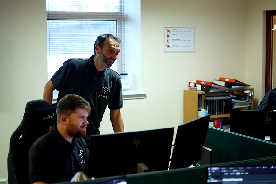 Jera IT team working on the computer together